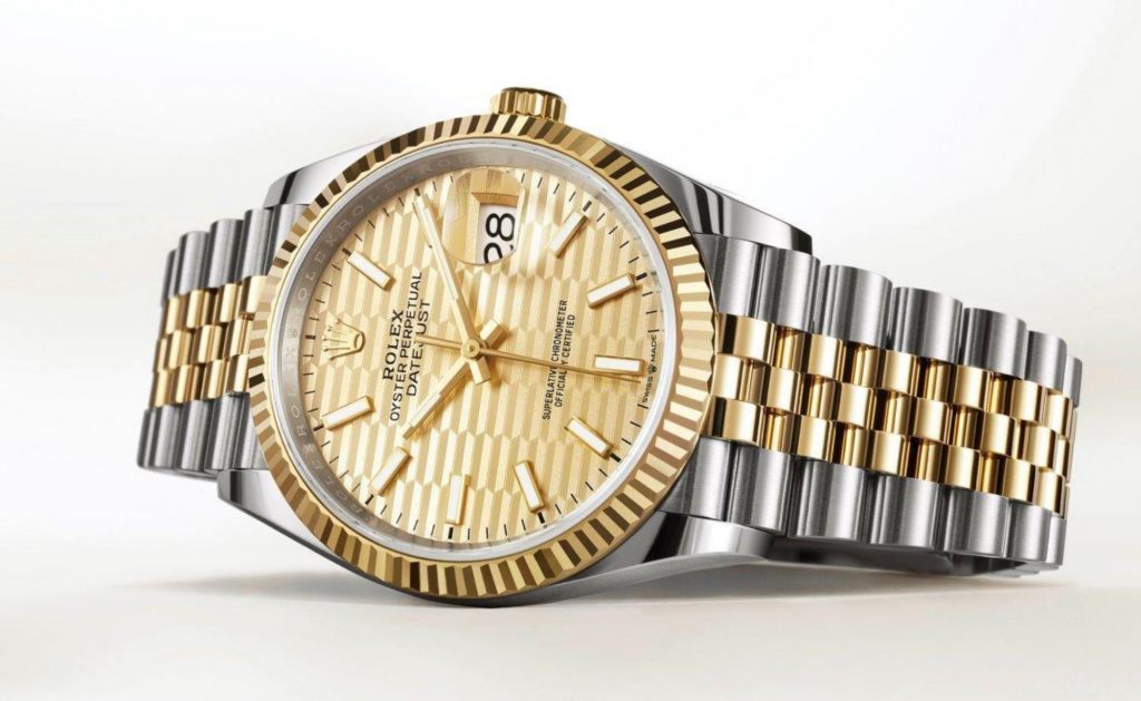 The 36mm replica watch is made from polished 18ct gold and Oystersteel.